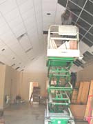 Installing ceiling tiles in the entry