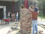 Laying brick for the columns at the preschool entrance