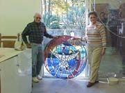 Barbara and Russ with the window they donated