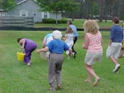 Adult and teens on an Easter Egg Hunt