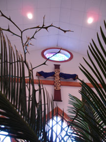 Kenn's photo of the cross over the altar seen through the Palm Sunday greens