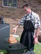 Scott grills hot dogs